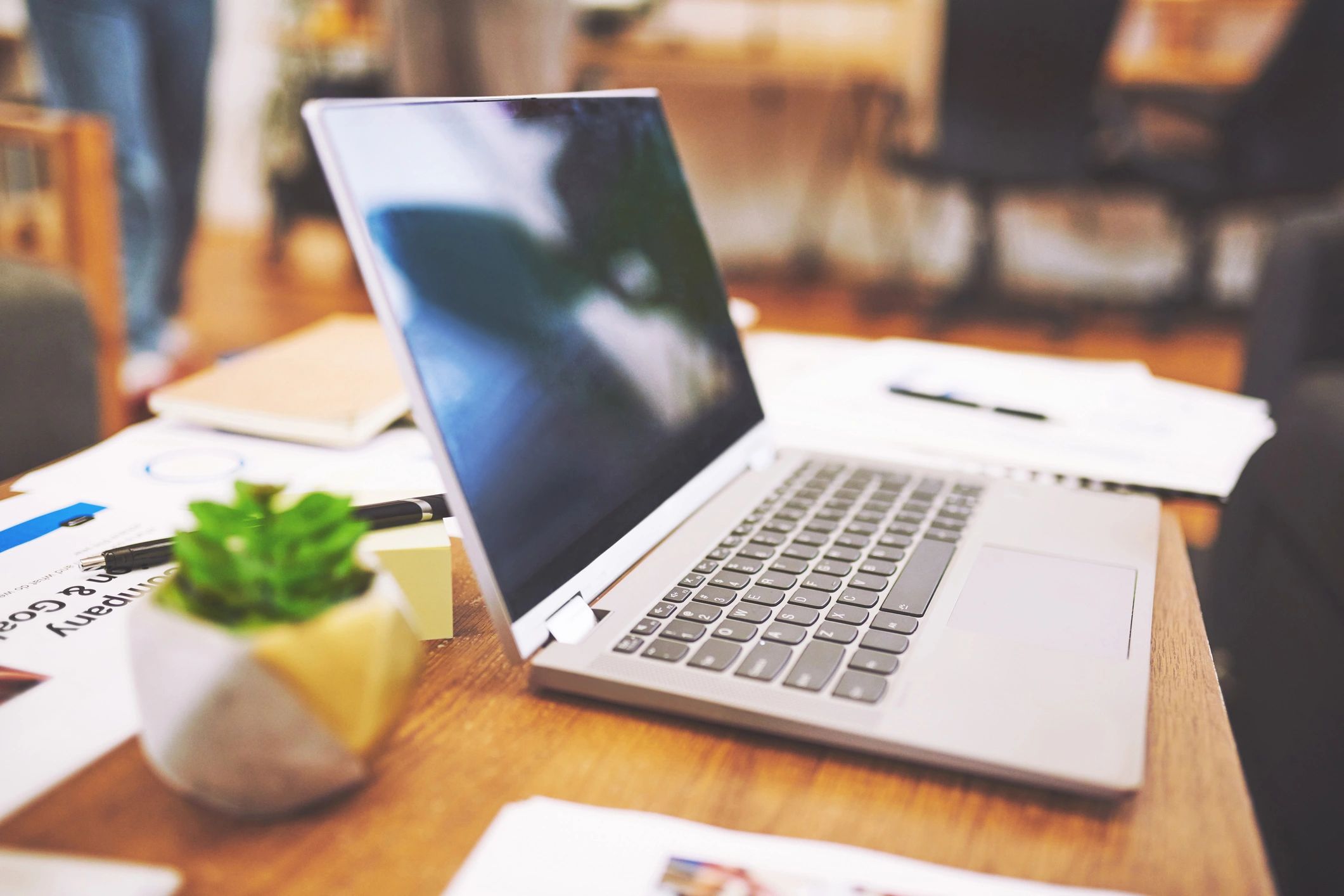 Laptop and study notes on a desk for medical education