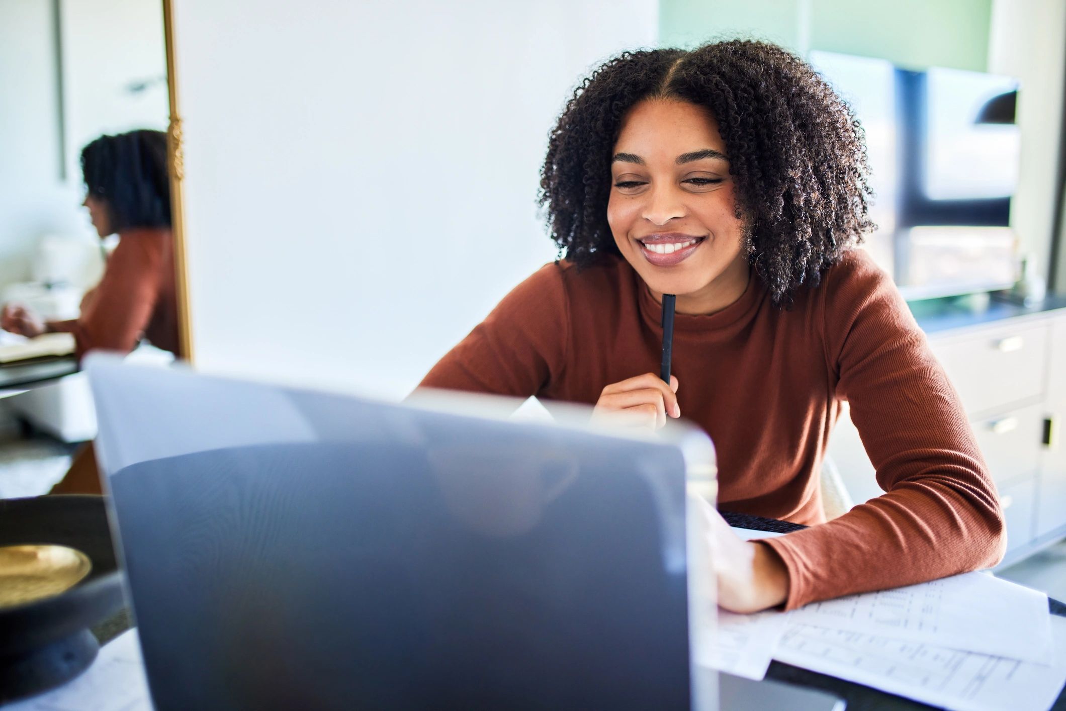 Nursing student studying on a laptop at a desk